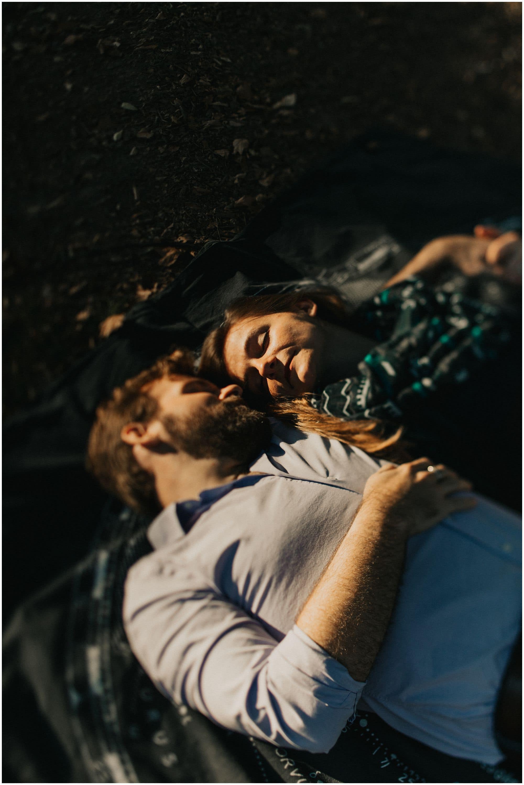 laying down engagement photo, unposed natural wedding photography 