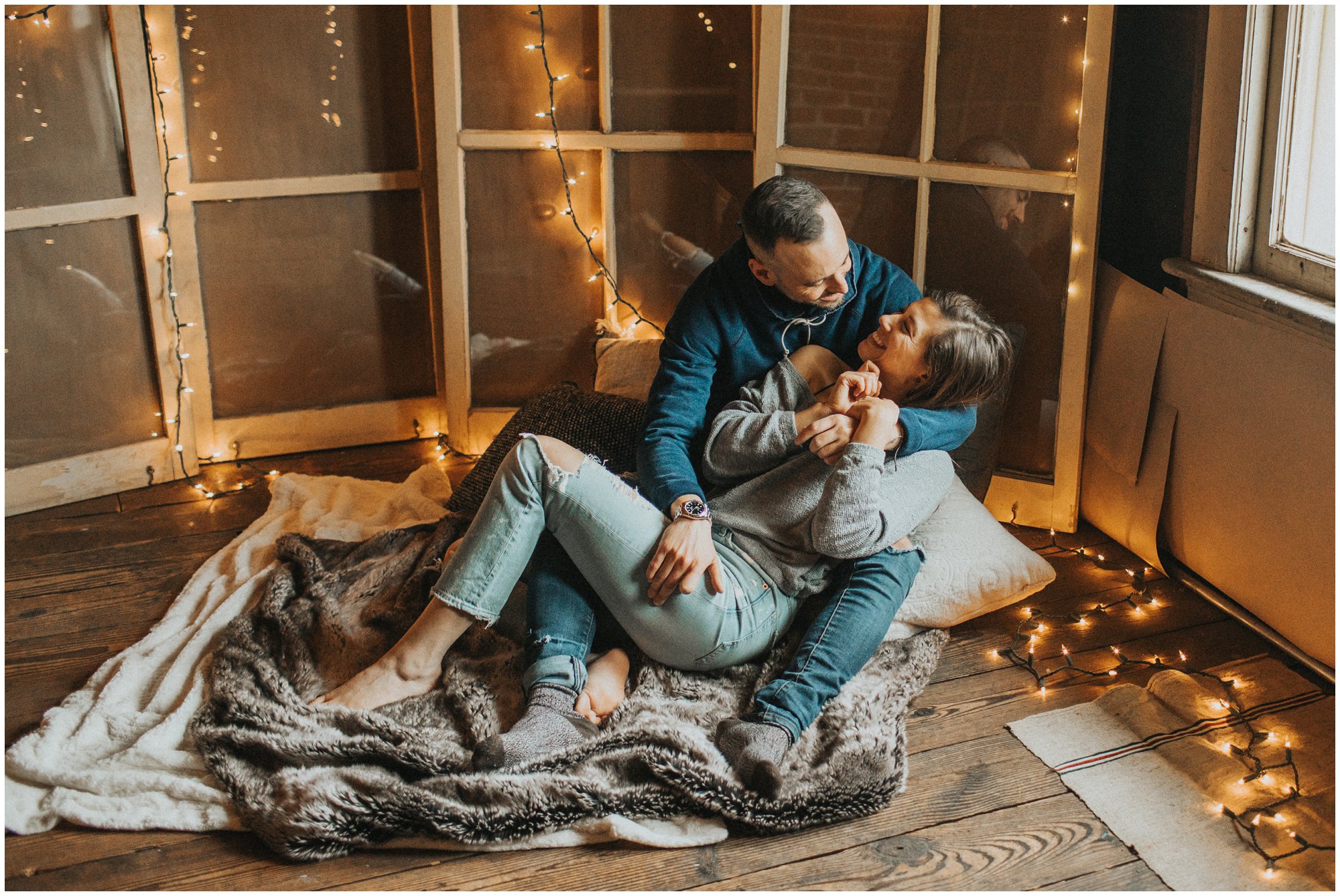 fun intimate engagement photography at home with string lights